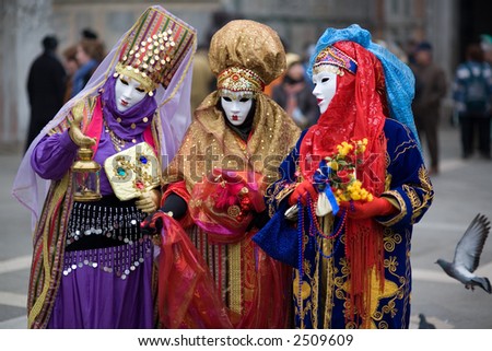 stock-photo-three-people-are-dressed-for-the-carnival-in-venice-italy-2509609.jpg