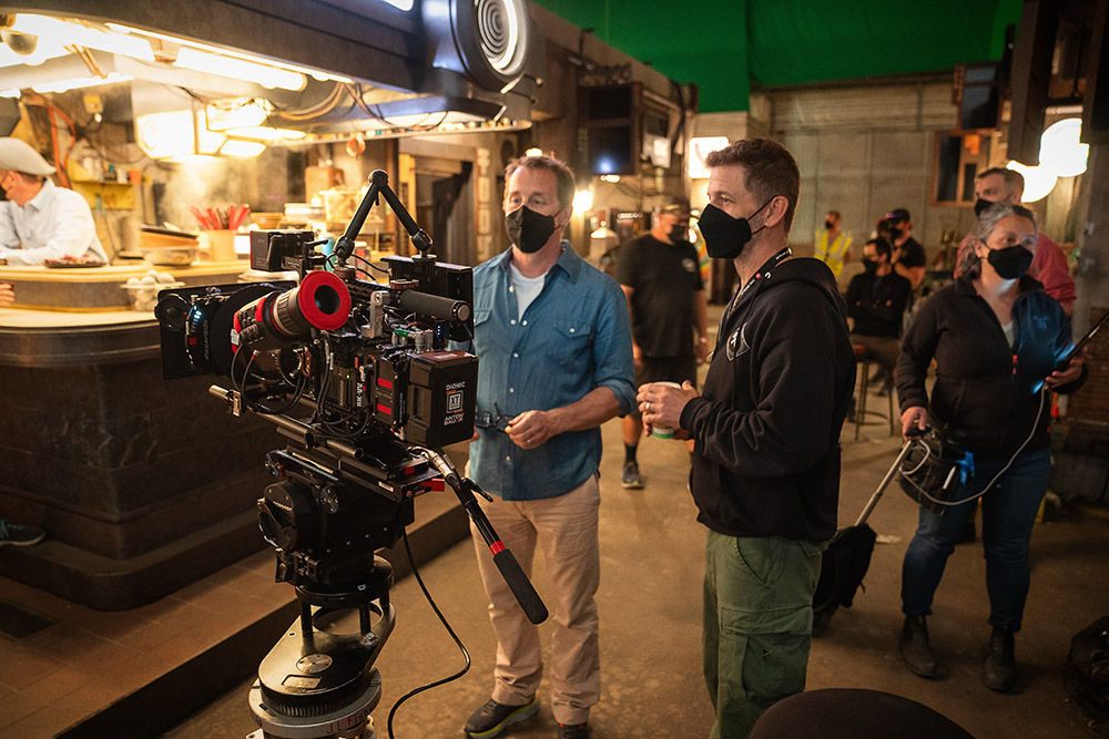 (L-R) screenwriter/producer Kurt Johnstad and director/writer/producer Zack Snyder on the set of Rebel Moon — Part One A Child of Fire.